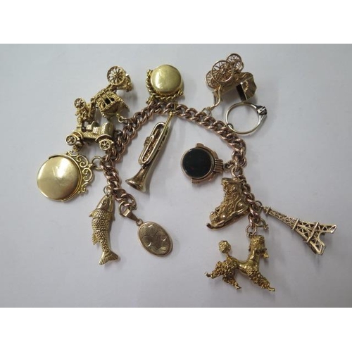 468 - A 9ct yellow gold charm bracelet with 8 charms, 3 fobs and a locket and a ring, total weight approx ... 