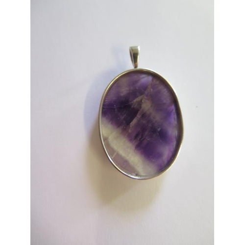 470 - A blue John pendant in a silver mount, 5cm x 3cm, with natural flaws but good condition