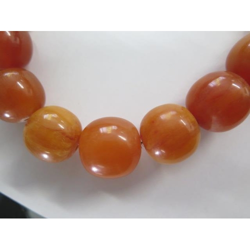 473 - A butterscotch similar type bead necklace, 52cm long, largest bead approx 2cm x 2.5cm, approx 118 gr... 