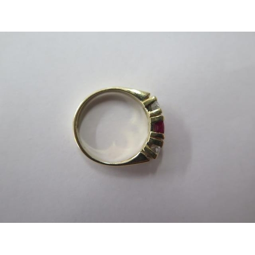 478 - A yellow gold three stone ruby and diamond ring, each stone approx 0.25ct, diamonds bright and livel... 