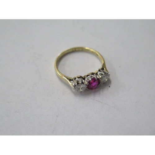 484 - An 18ct gold and platinum three stone diamond and ruby / spinnel ring, diamonds approx 0.20ct each, ... 