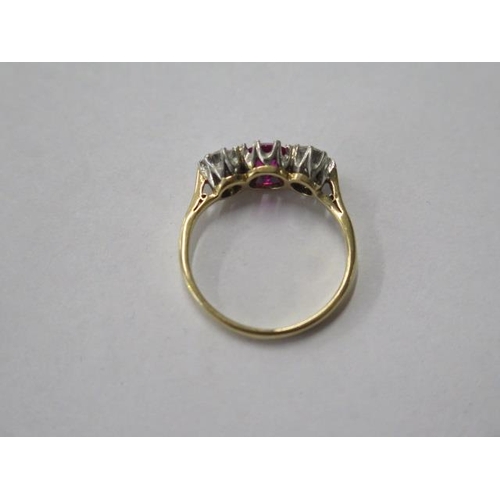 484 - An 18ct gold and platinum three stone diamond and ruby / spinnel ring, diamonds approx 0.20ct each, ... 