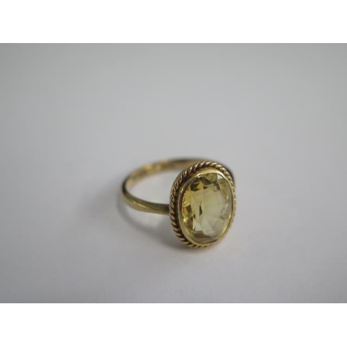 499 - A 9ct yellow gold citrine ring, size N, approx 3.6 grams, in generally good condition