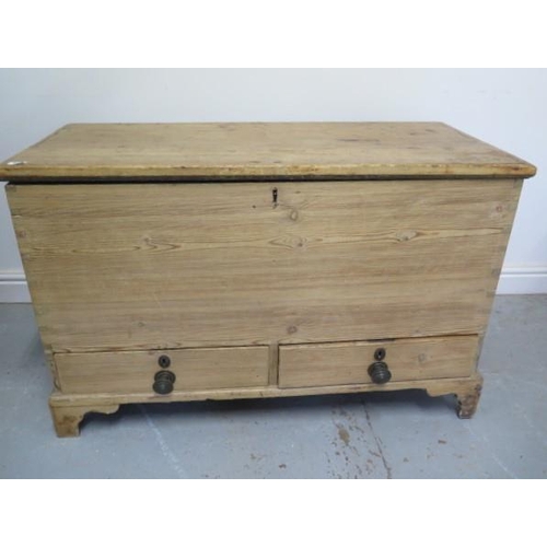 58 - A Georgian stripped pine two drawer mule chest with an interesting papered interior and secret drawe... 