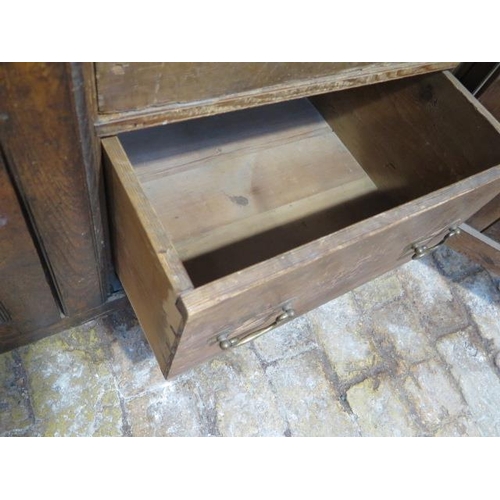 60 - A Georgian oak country dresser with an open rack top above 3 freize drawers and 3 cupboard doors, th... 