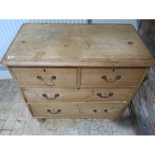 63 - A Victorian stripped pine 4 drawer chest on turned feet, 84cm tall x 85cm x 46cm, missing one handle