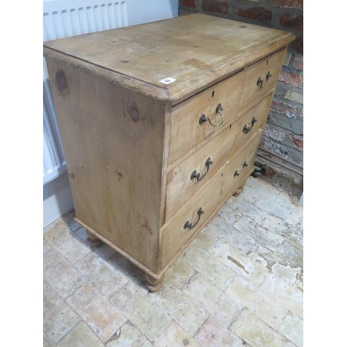 63 - A Victorian stripped pine 4 drawer chest on turned feet, 84cm tall x 85cm x 46cm, missing one handle