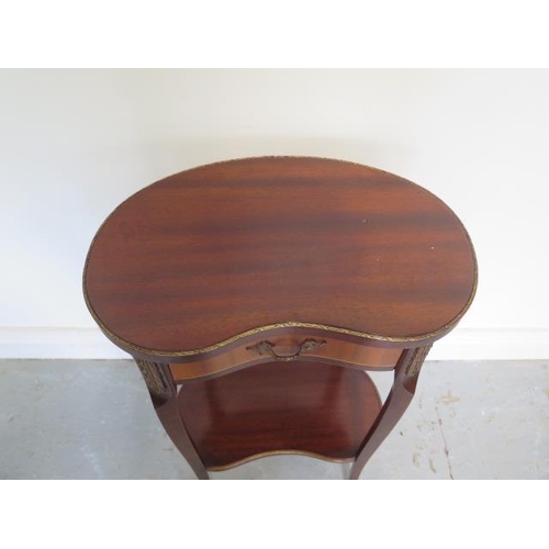70 - A French mahogany and oak inlaid kidney shaped 2 tier lamp table with frieze drawer with brass and o... 