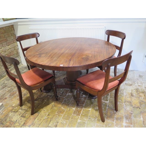 72 - A 19th century breakfast mahogany table with 4 chairs, the table of circular form on central column ... 