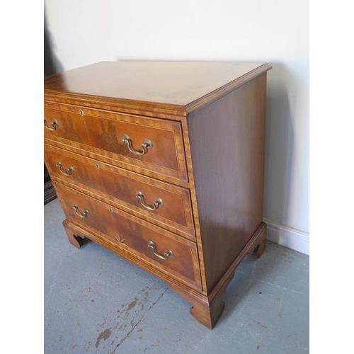 77 - A reveneered 3 drawer chest with star inlay, standing on shaped bracket feet, 90cm tall x 95cm x 50c... 
