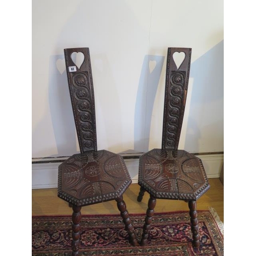 82 - A pair of carved spinning chairs, 87cm tall