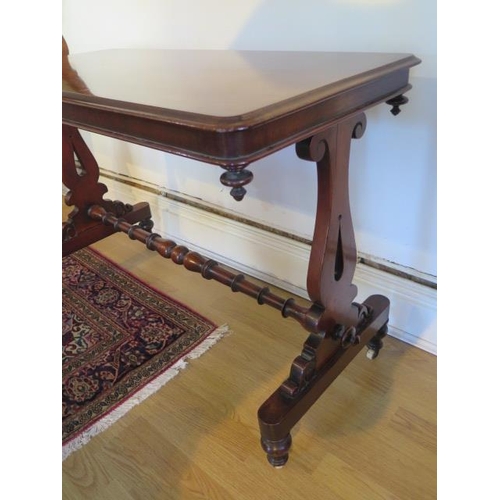 87 - A Victorian mahogany stretcher table, 73cm x 106cm x 49cm