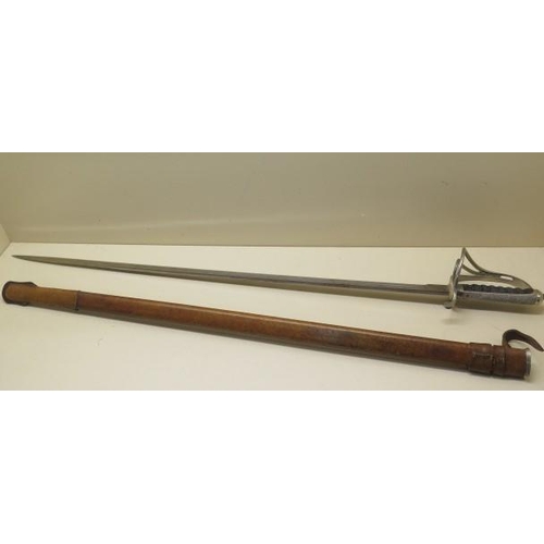 902 - A British officers sword with shagreen grip and leather scabbard, 88cm fullered blade