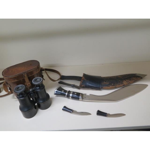 907 - A Kukri with scabbard and small knives, blade length 31cm, some pitting to blades and wear to scabba... 