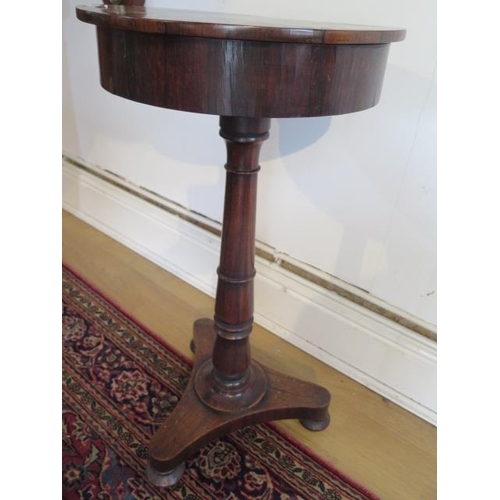 96 - A rosewood table jardiniere stand with a 38cm diameter lift off top on a turned column and tripartit... 