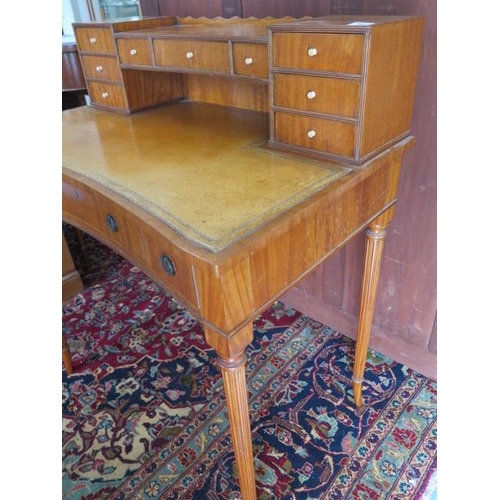 99 - A satin walnut ladies writing desk with a 9 drawer upstand and leather inset top over 3 frieze drawe... 