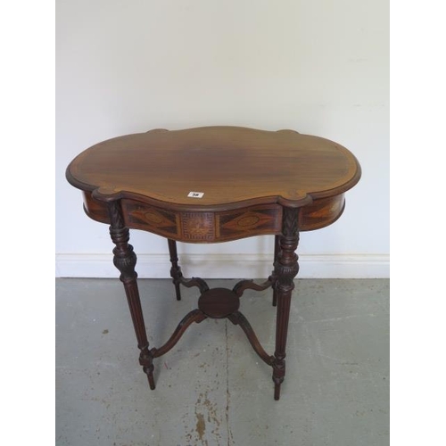 58 - An Edwardian inlaid side table with a shaped top on carved reeded legs united by an undertier, 72cm ... 