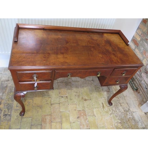 76 - A circa 1930's walnut 5 drawer desk / side table with floating gallery on carved cabriole legs, 84cm... 
