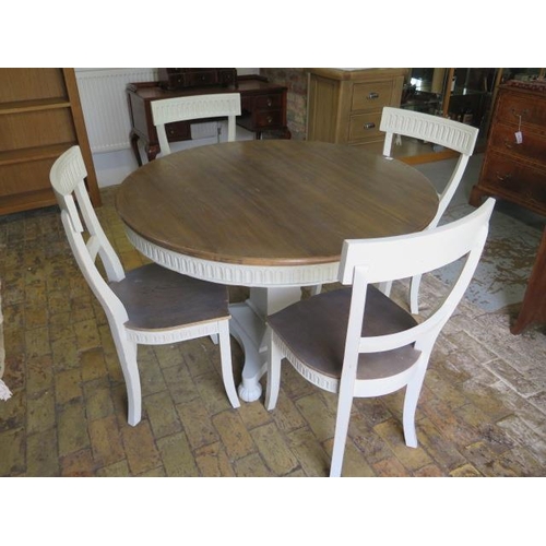 13 - A shabby chic circular dining table on a square tapering column and quatrefoil platform base and 4 m... 