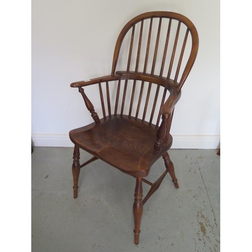 11 - An ash and elm 19th century style Windsor stick back elbow chair, 101cm tall