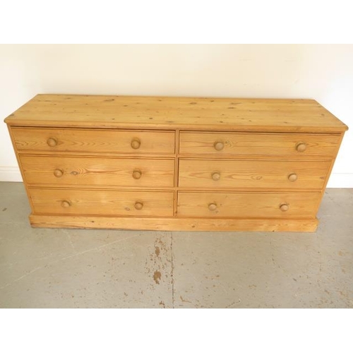 20 - A pine 6 drawer long chest, 69cm tall x 173cm x 44cm, in good condition