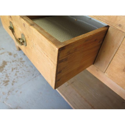 52 - A Georgian stripped pine dresser base with three drawers above a pot board on square chamfered legs,... 