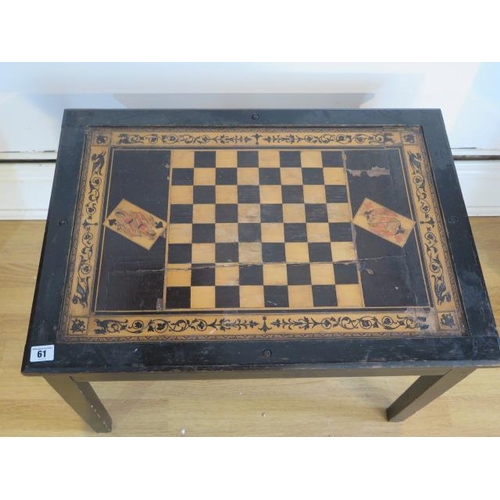 61 - An ebonised chess games table with lift up top