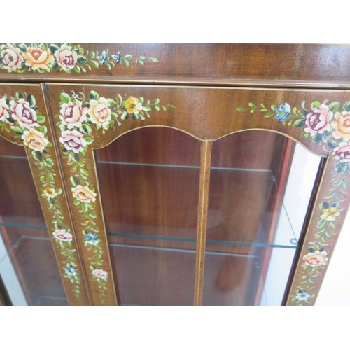 66 - A pretty decorated mahogany two door glazed display cabinet with 3 shelves, 126cm tall x 76cm x 32cm... 