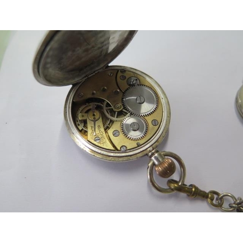 667 - A silver top wind pocket watch on chain, 45mm case, running, a Goliath type watch, 75mm case, needs ... 