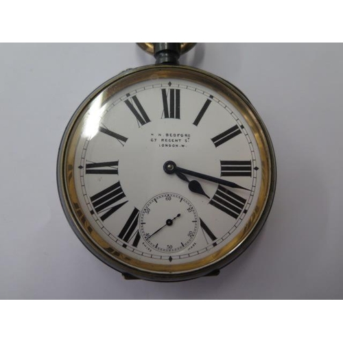 667 - A silver top wind pocket watch on chain, 45mm case, running, a Goliath type watch, 75mm case, needs ... 