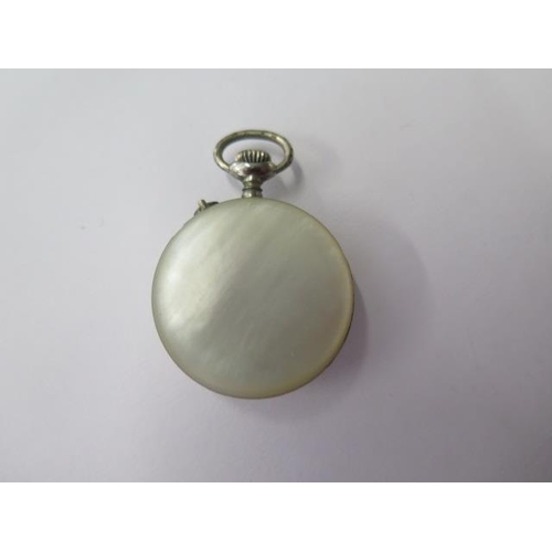 667 - A silver top wind pocket watch on chain, 45mm case, running, a Goliath type watch, 75mm case, needs ... 