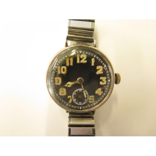 675 - A silver Cunard black dial trench type watch, 32mm case on a later sprung strap, working, hands adju... 