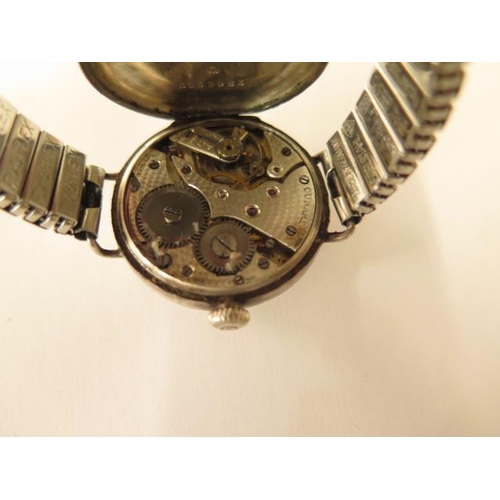 675 - A silver Cunard black dial trench type watch, 32mm case on a later sprung strap, working, hands adju... 