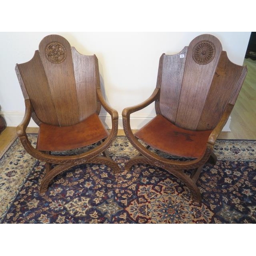 74 - A pair of early 20th century oak Abbots style chairs with leather seats, 93cm tall x 60cm wide, seat... 