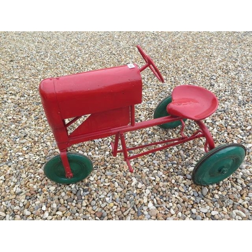 751 - A Tri-ang 3 wheel tinplate pedal tractor, 67cm tall x 96cm long, in working order, repainted