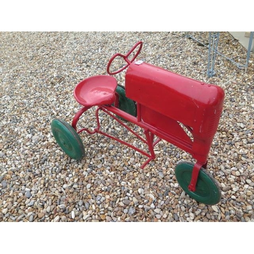 751 - A Tri-ang 3 wheel tinplate pedal tractor, 67cm tall x 96cm long, in working order, repainted