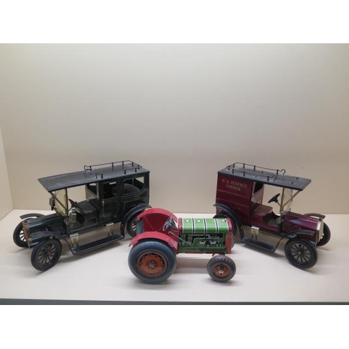 757 - A tinplate clockwork tractor, 22cm long, and two tinplate static