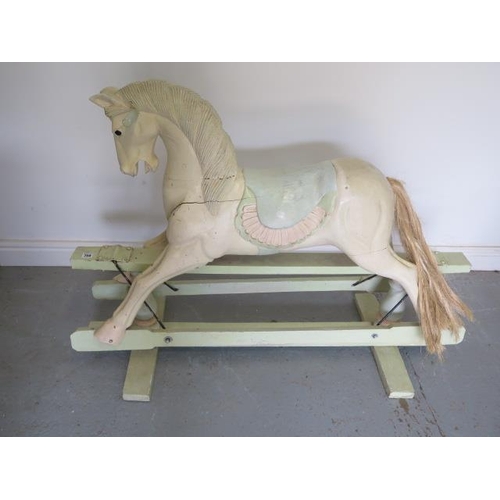 759 - A painted carved wooden Rocking Horse, possibly an adapted fairground carousel horse, 92cm tall x 12... 