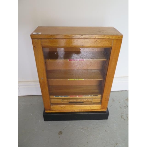 78 - A small oak cabinet with a drawer to hold fuses, 52cm tall x 39cm x 17cm