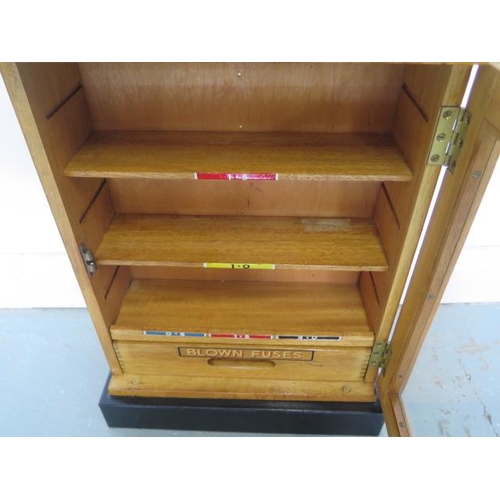 78 - A small oak cabinet with a drawer to hold fuses, 52cm tall x 39cm x 17cm