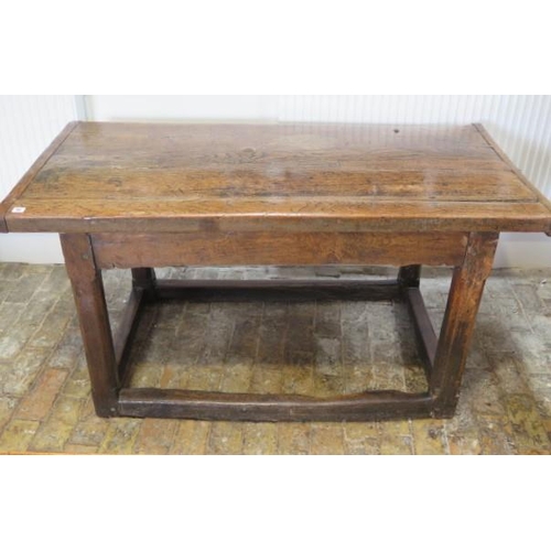 93 - An 18th century oak dining table with a 5cm thick top on square chamfered legs united by all round s... 