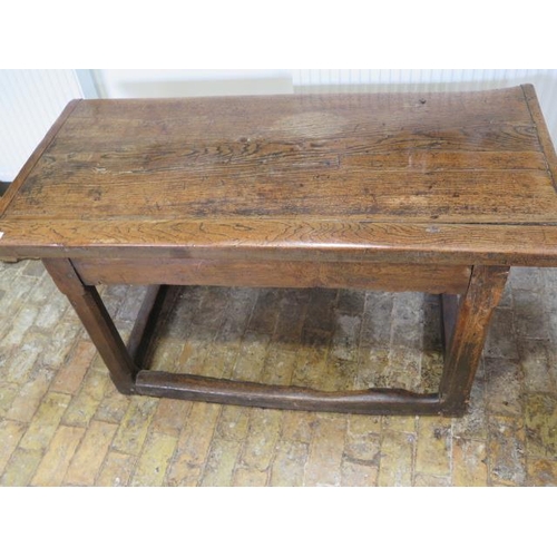 93 - An 18th century oak dining table with a 5cm thick top on square chamfered legs united by all round s... 