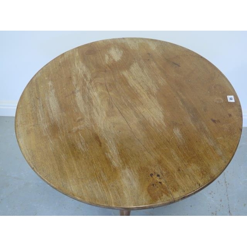 95 - A Georgian mahogany tilt top side table with a single piece 80cm top on a tapering gun barrel column... 