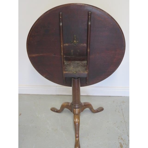 95 - A Georgian mahogany tilt top side table with a single piece 80cm top on a tapering gun barrel column... 