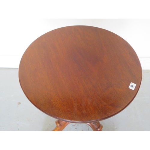 97 - A mahogany circular side table on a carved tripod base, 57cm tall x 53cm diameter, in good polished ... 