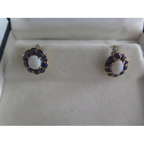 A good pair of antique opal and gold earrings, not hallmarked but tests to approx 9ct with higher carat wash to fronts, overall 14mm x 16mm, opals 8mm x 6mm, good colour to all stones, screw back fasteners but could be altered, good condition, approx 4.2 grams