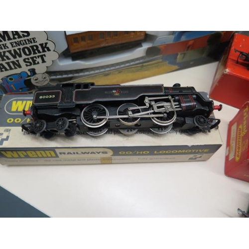 773 - A boxed Wrenn 2-6-4 tank loco, two boxed Hornby locos, a boxed Thomas clockwork tram set and a Hornb... 