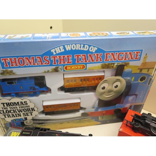 773 - A boxed Wrenn 2-6-4 tank loco, two boxed Hornby locos, a boxed Thomas clockwork tram set and a Hornb... 