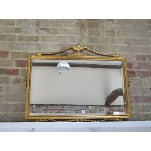 10 - A decorative gilt wall mirror, 30cm x 93cm