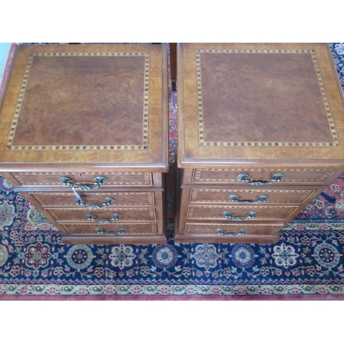 100 - A pair of 4 drawer bedside chests re-veneered with checker inlay, 73cm tall x 44cm x 40cm